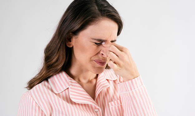 woman who just used saline nasal spray prevent colds